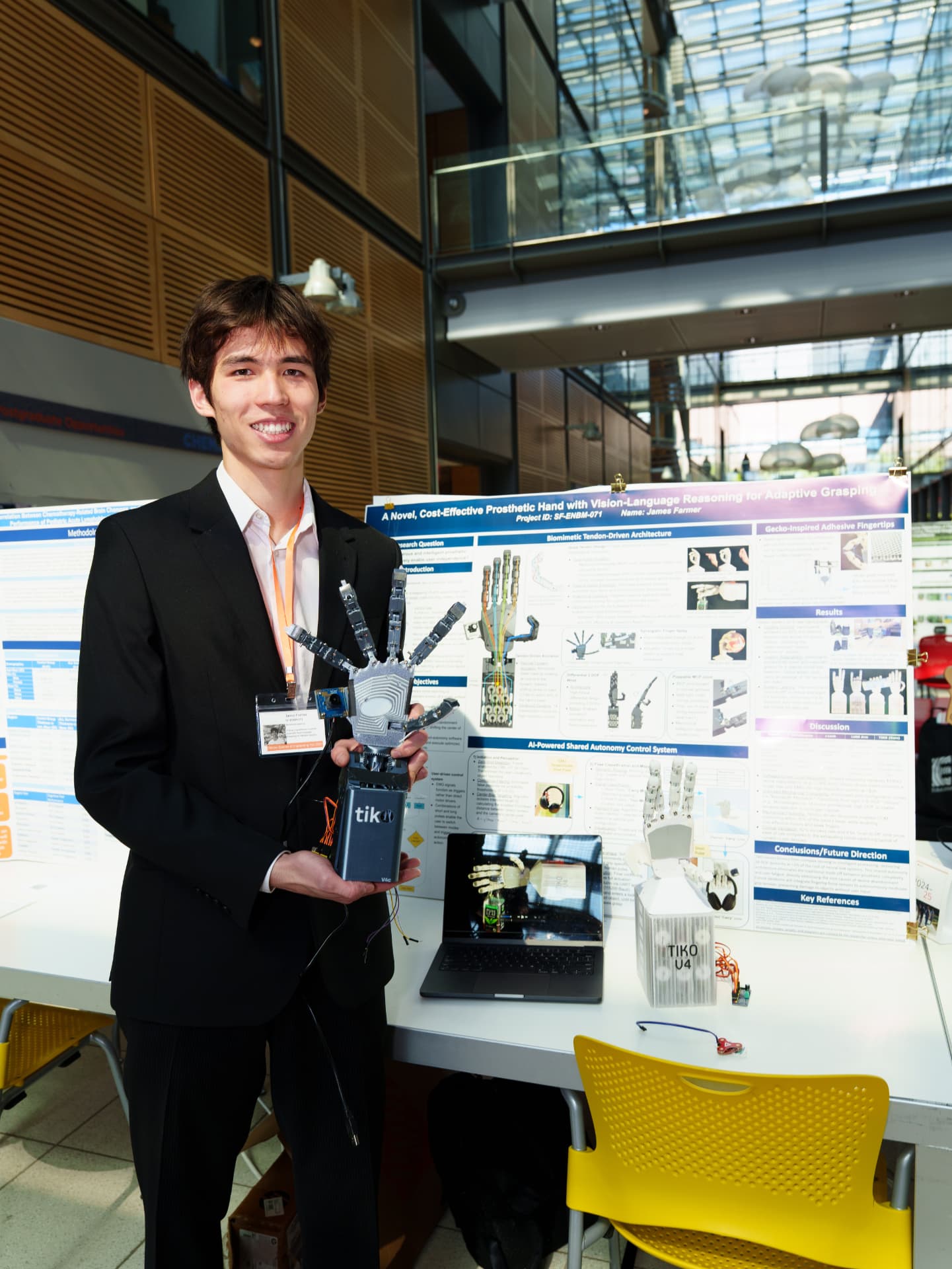 James Farmer presenting the TIKO prosthetic hand research poster