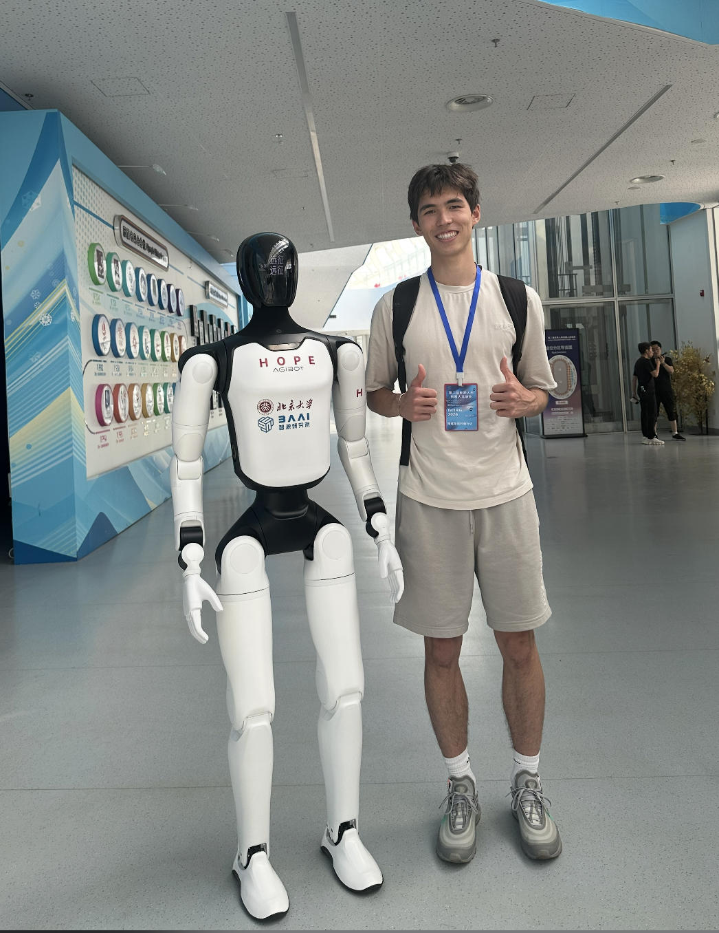 James Farmer with a humanoid robot